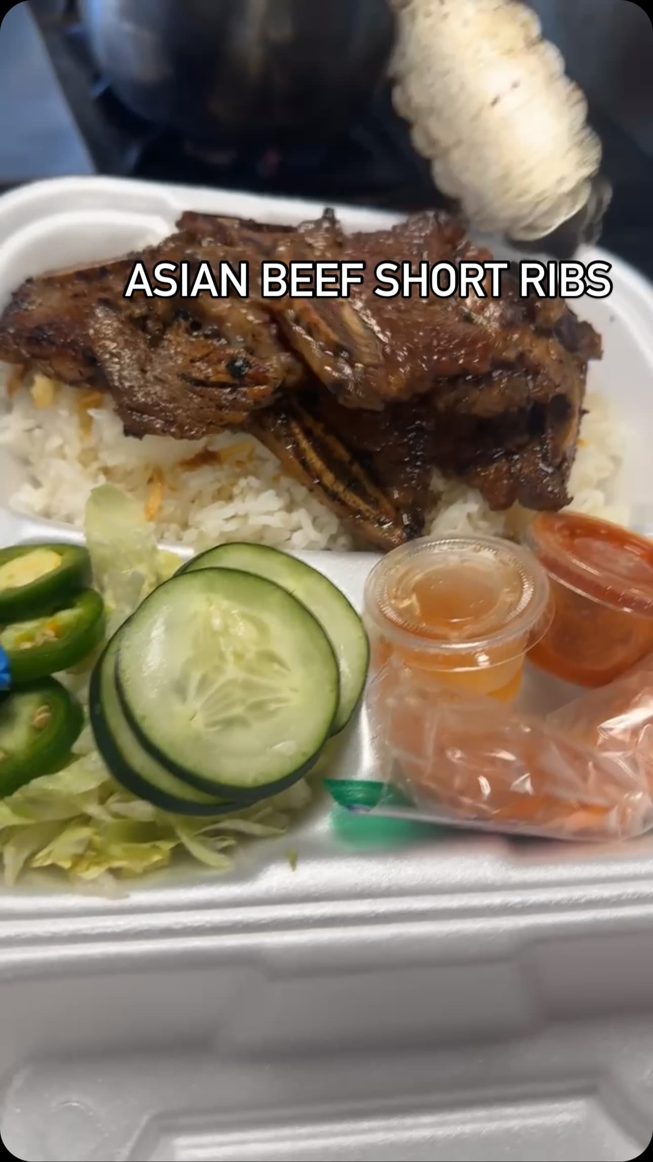 Asian beef short ribs over rice with pickled veggies
